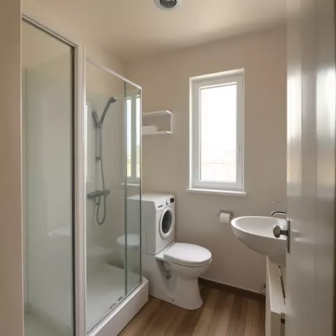 Aranżacja małej łazienki z prysznicem i pralką w bloku